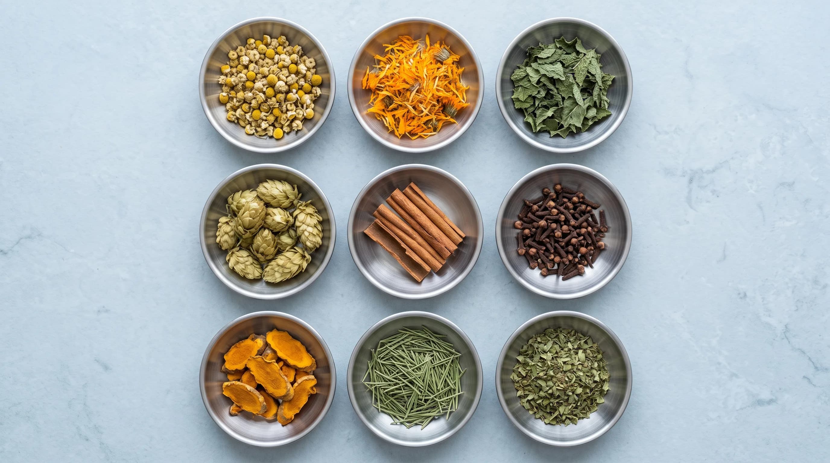 Nine dried botanicals in stainless steel dishes